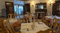 Individual tables in our dining room at Garden and Sea Inn